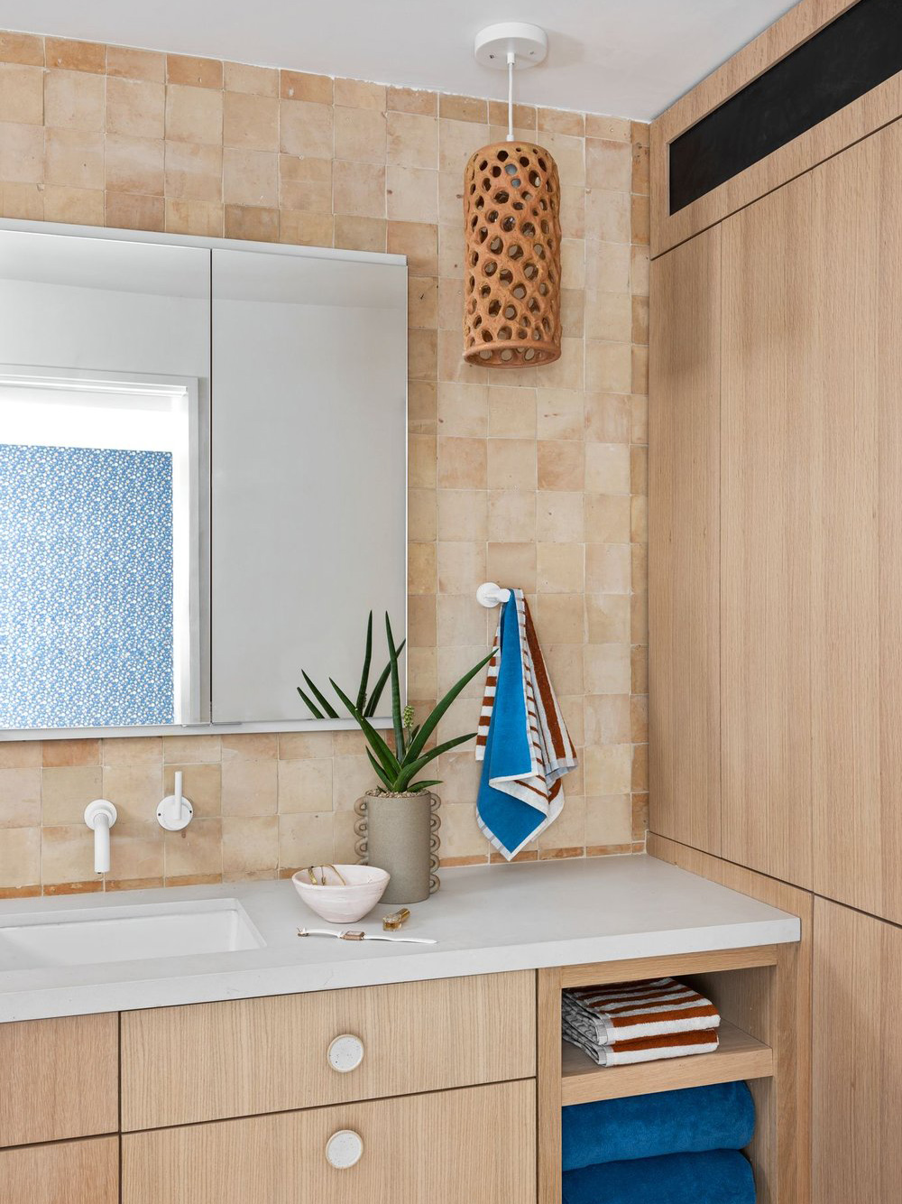 light oak vanity with zellige tile