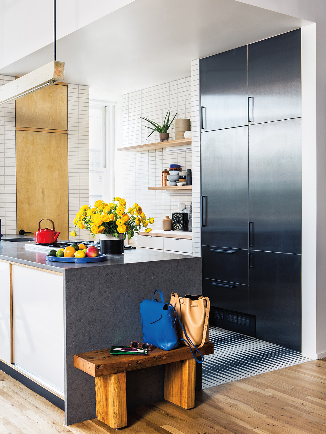 Open kitchen with dark cabinets and island