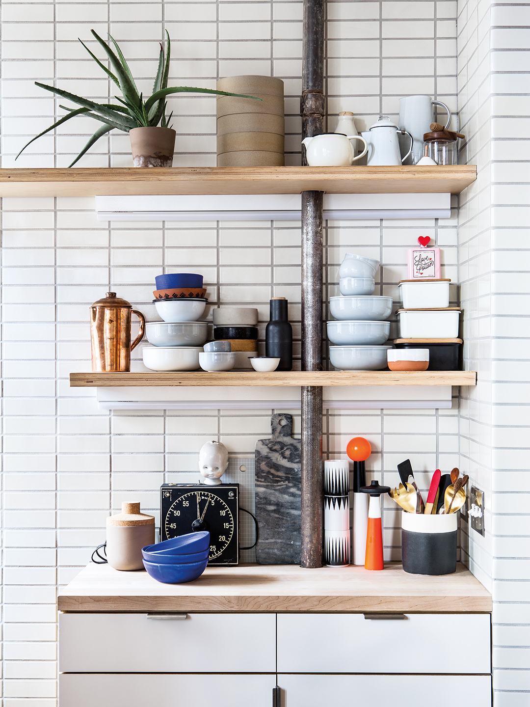 Open shelving with bowls and plants