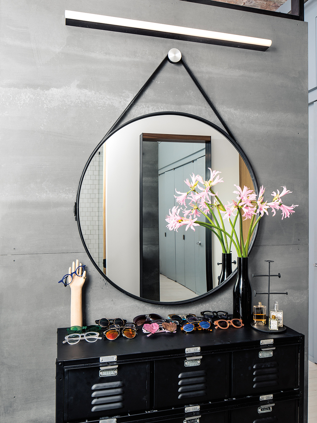 Round hanging mirror in bedroom