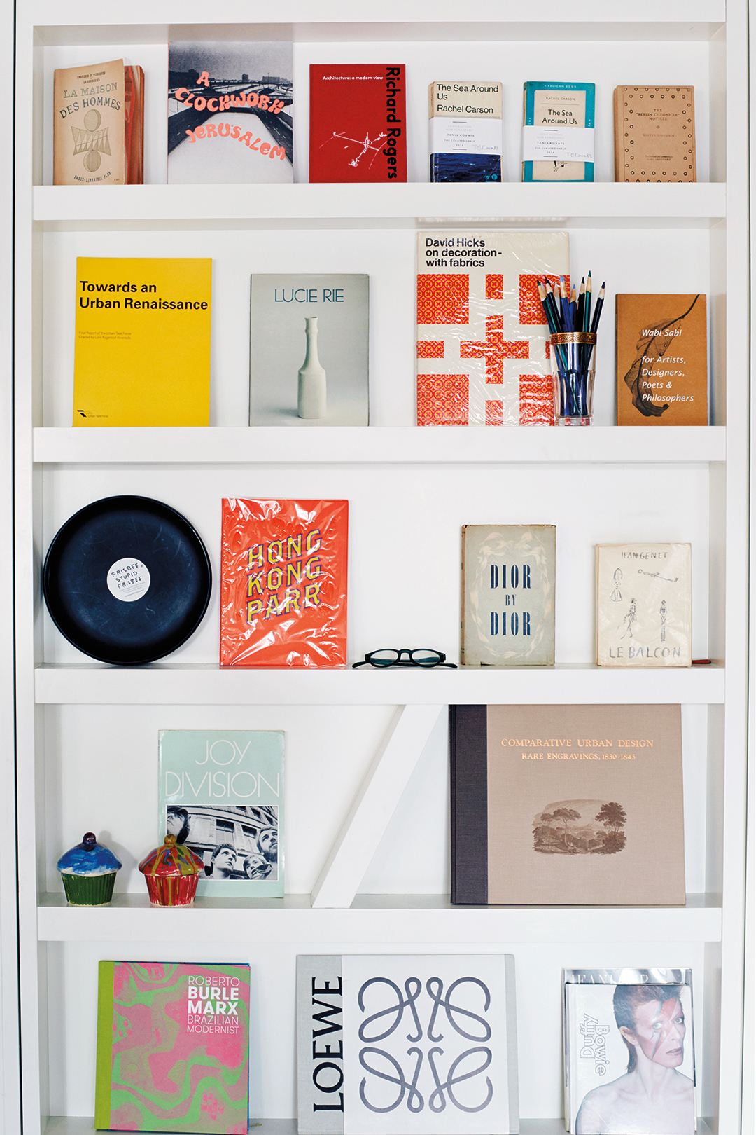 White bookshelf with books facing outwards