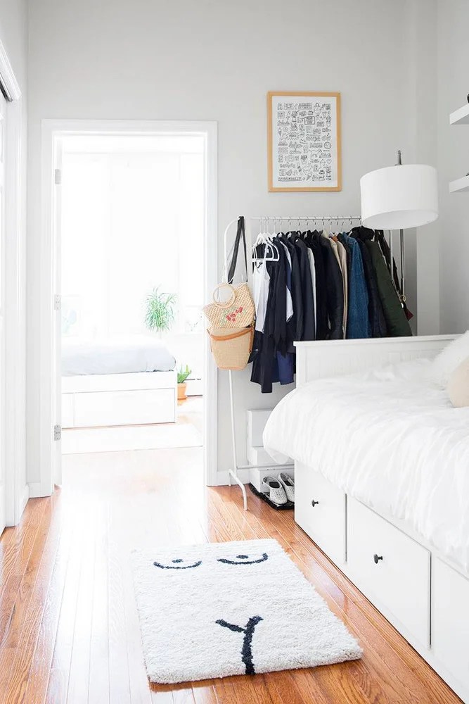 hallway with white bed