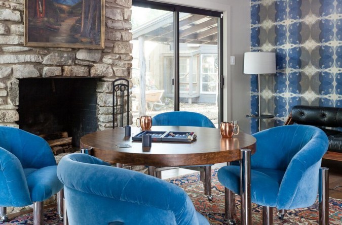 table with blue armchairs