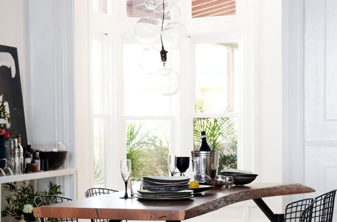 raw wood table with dishes on top