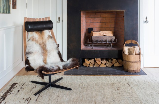 chair in front of fireplace