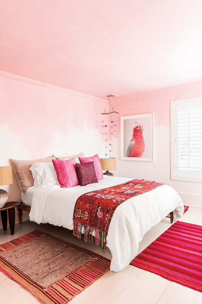 pink bedroom with boho textiles