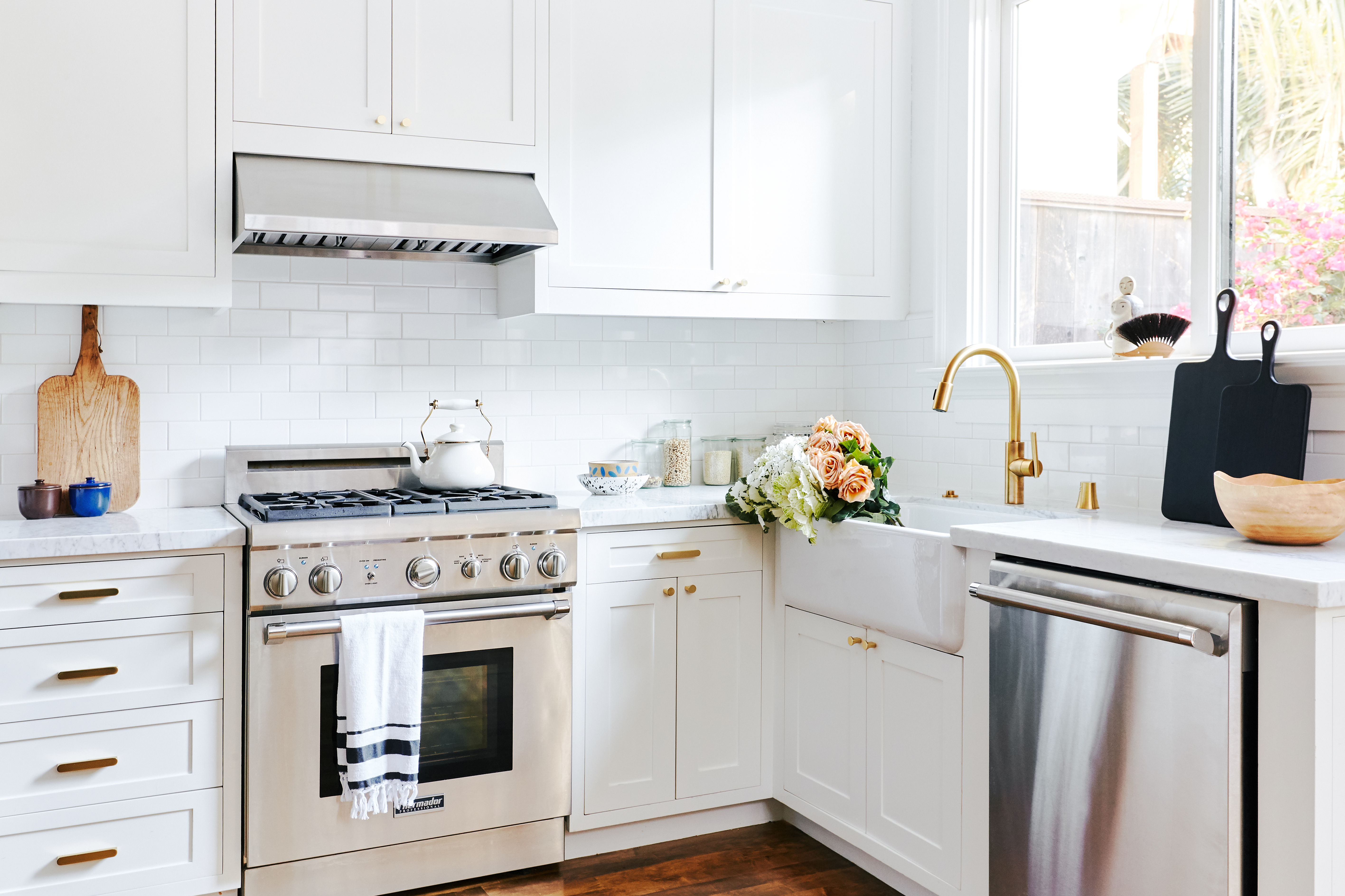 white kitchen with stainless steel appliances