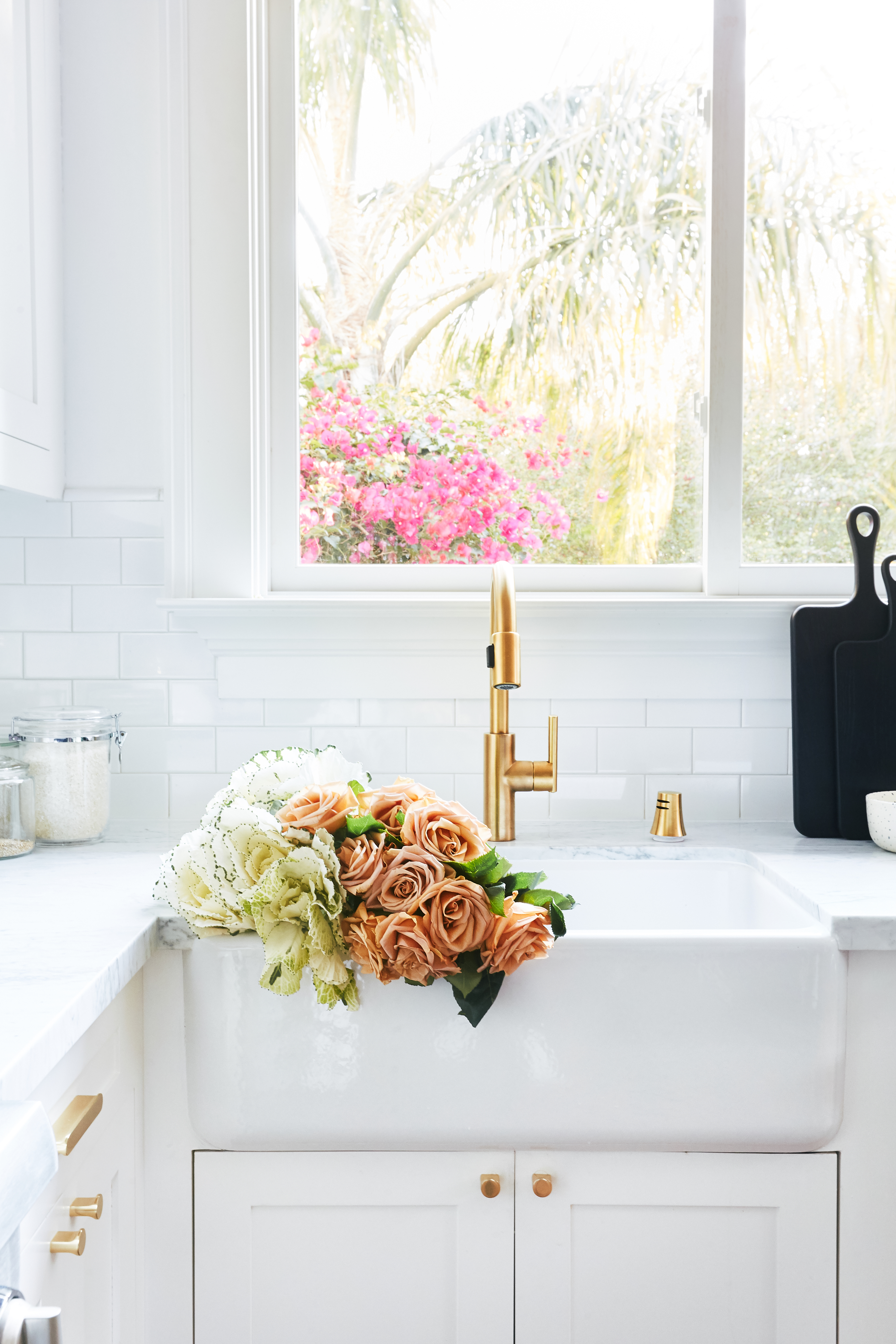 white farmhouse sink with roses