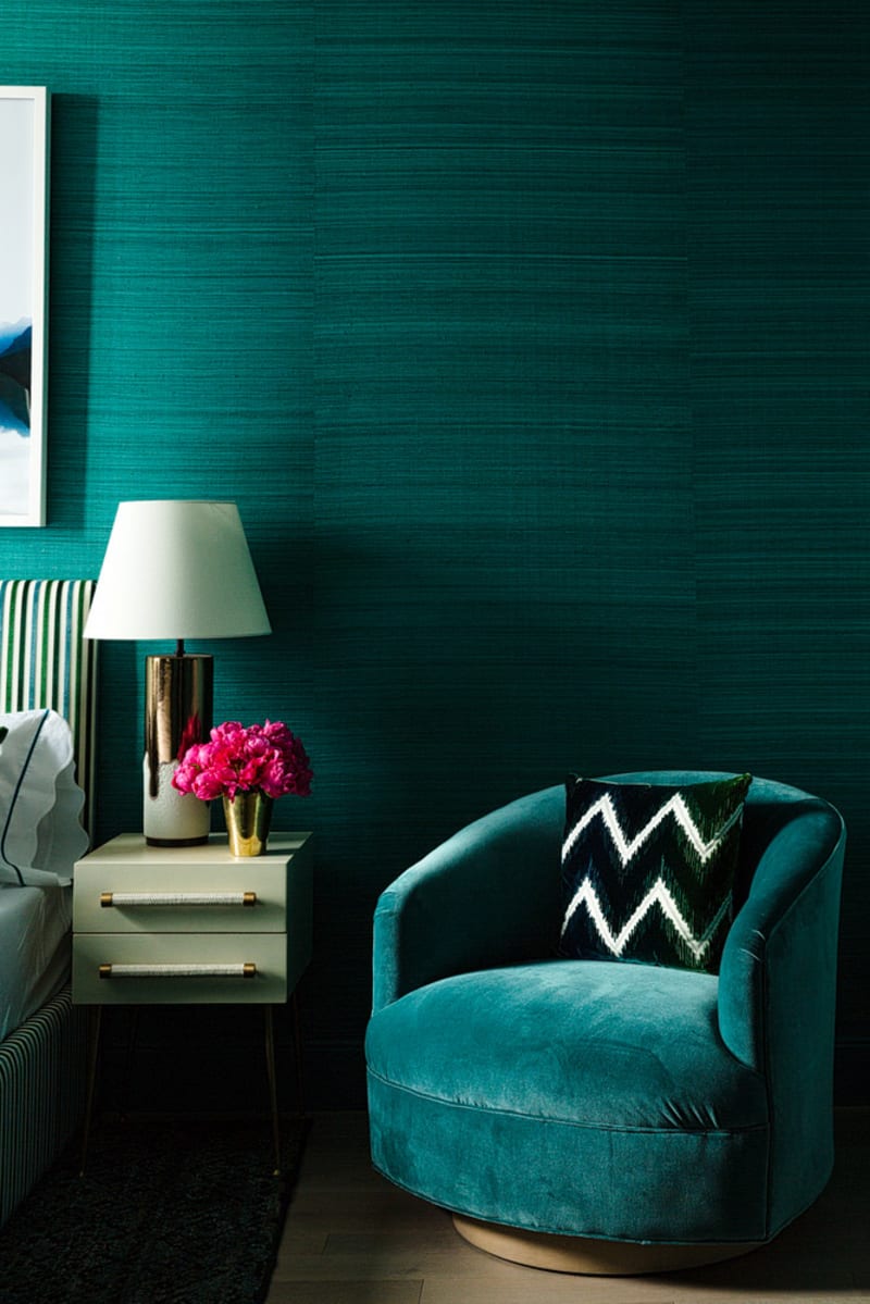 bedroom with jewel tone wall and furniture