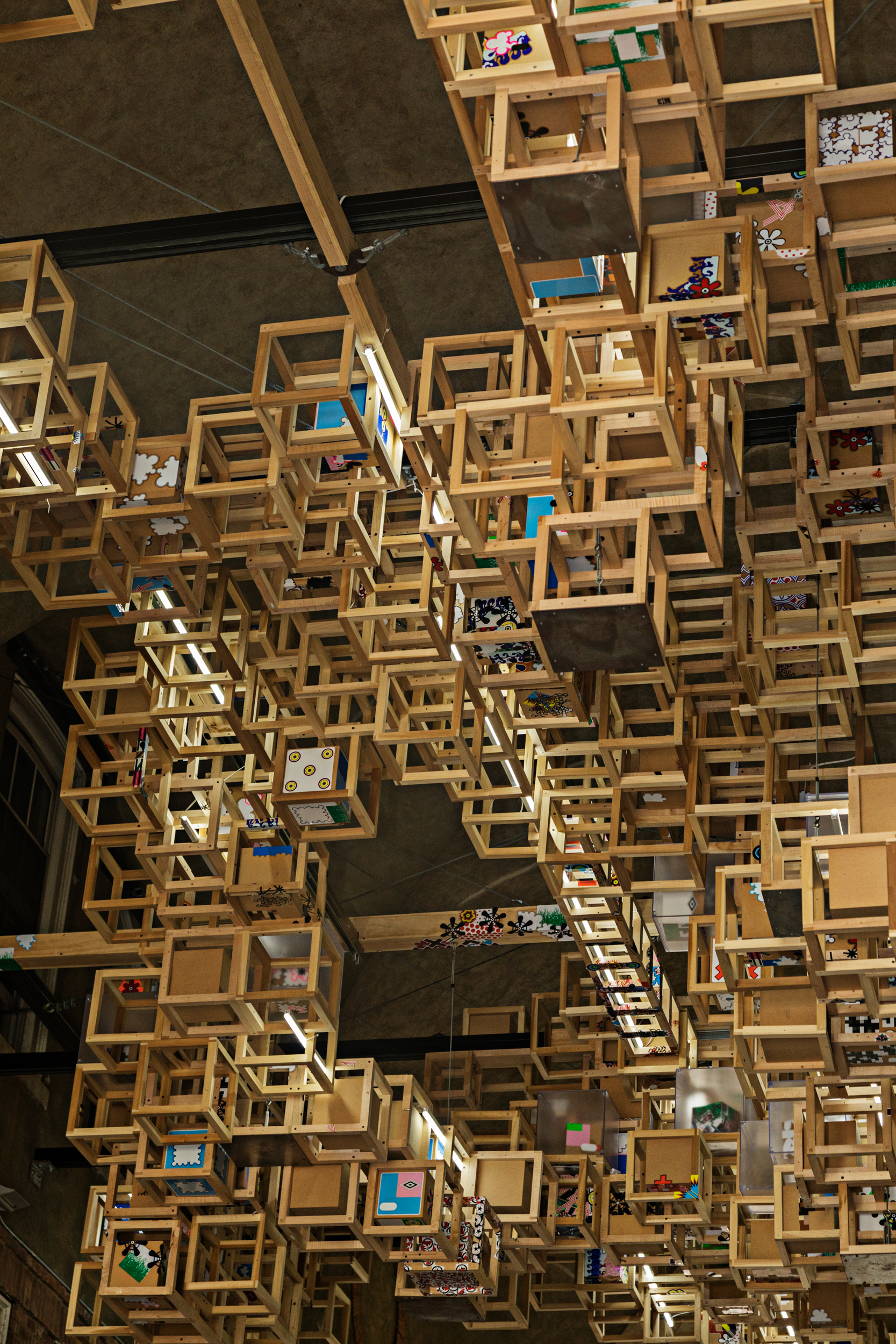 art exhibit of hanging boxes