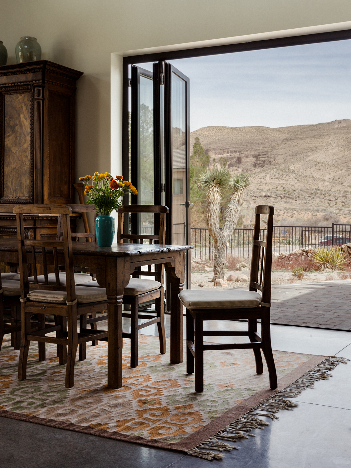 dining room with folding doors that open to terrace