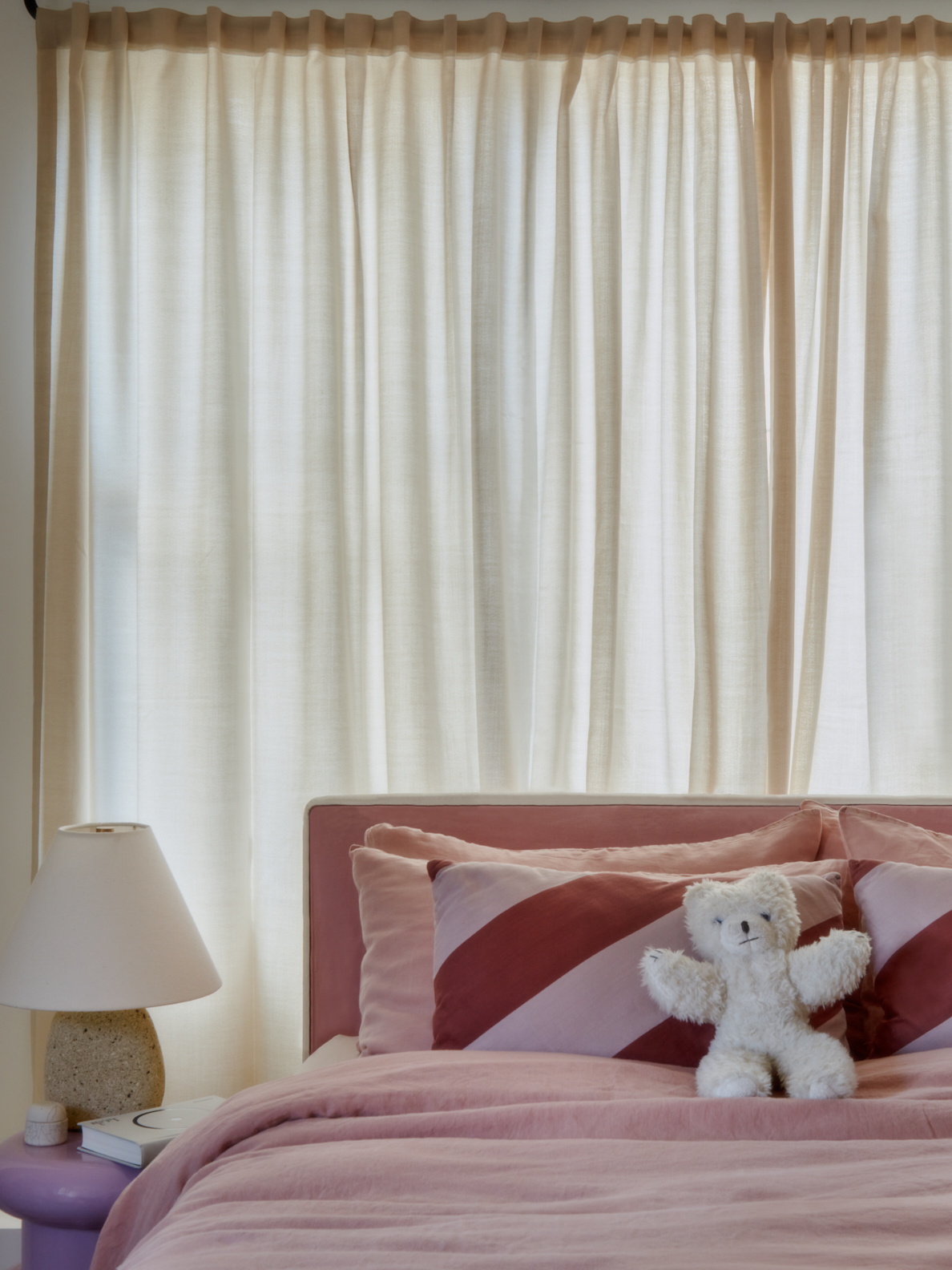 stuffed animal on adult bed