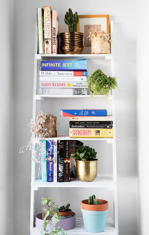 NYC Apartment Of Brooke Lucas Of The Wild Bunch White Shelving With Books