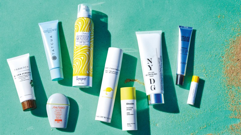 sunscreens on a green background