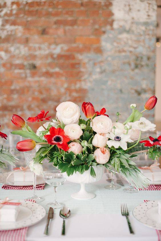 Spring Flower Arrangements white and red flowers on a table