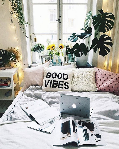 domino magazine bedroom with good vibes pillow