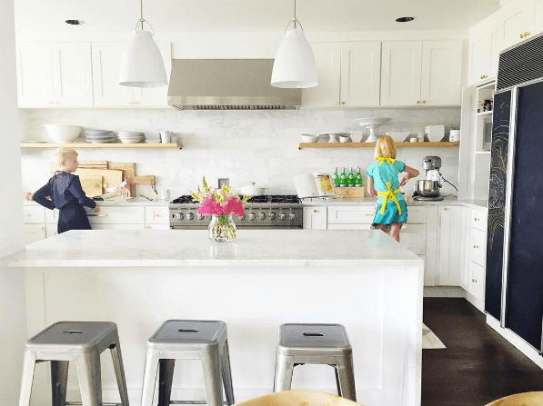 domino magazine white kitchen with metal barstools