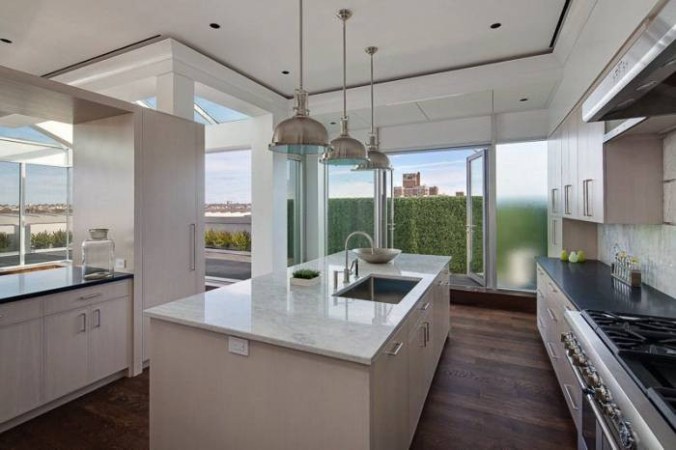 amy schumer new york white marble kitchen with hardwood floor