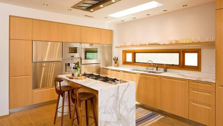 emma roberts wood kitchen cabinets with marble island