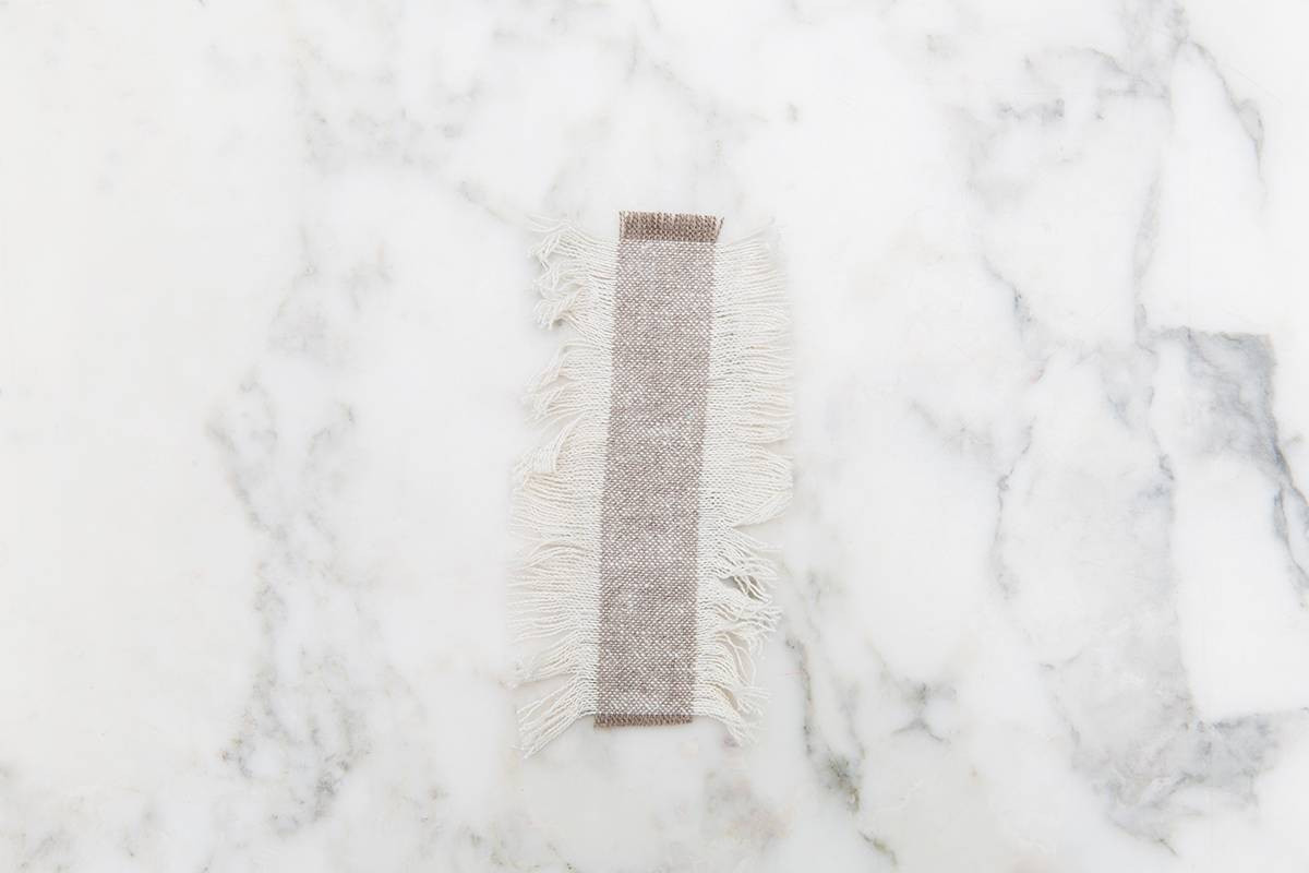 diy pillow tassels fabric on marble