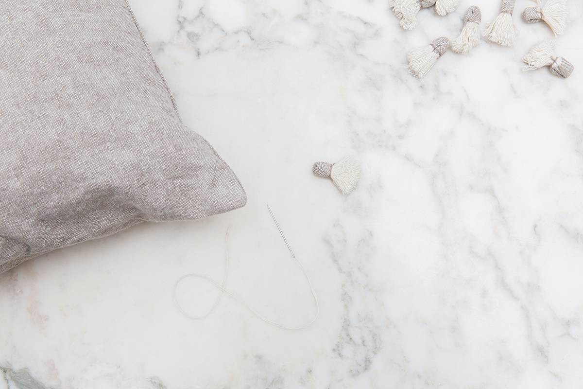 diy pillow tassels fabric on marble