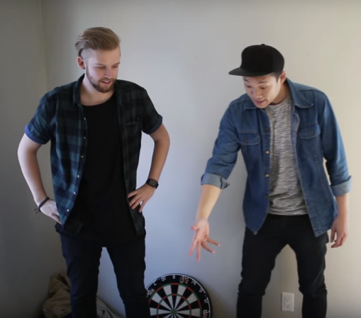 two young men in empty room