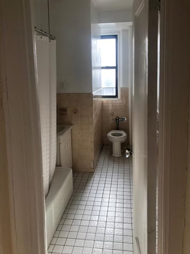 narrow dated bathroom