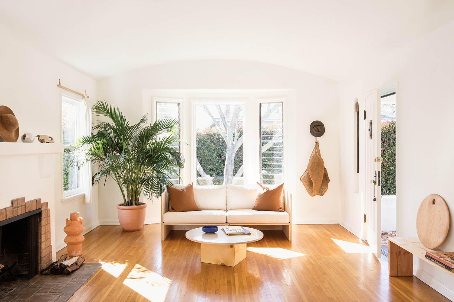 living room with windows, hardwood floor and white couch