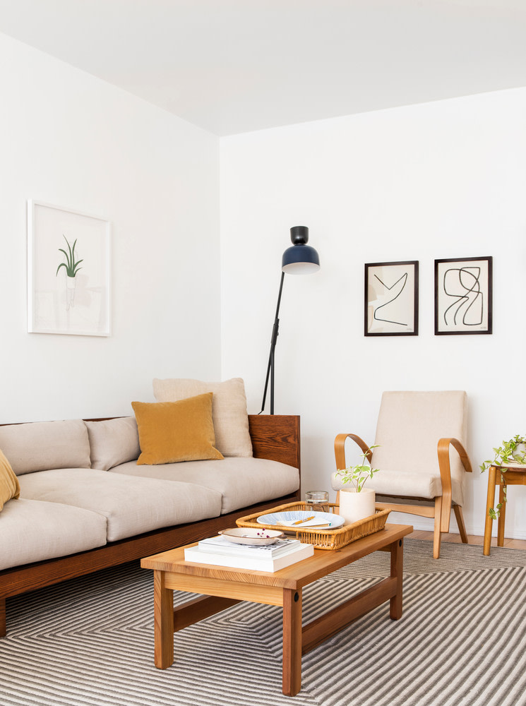 Sitting area with couch and striped rug