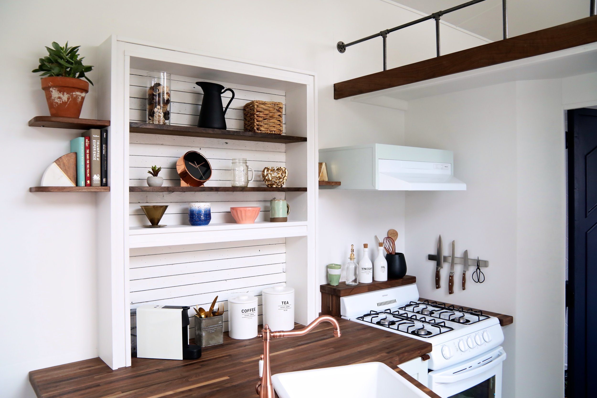 tiny home kitchen with exposed shelving