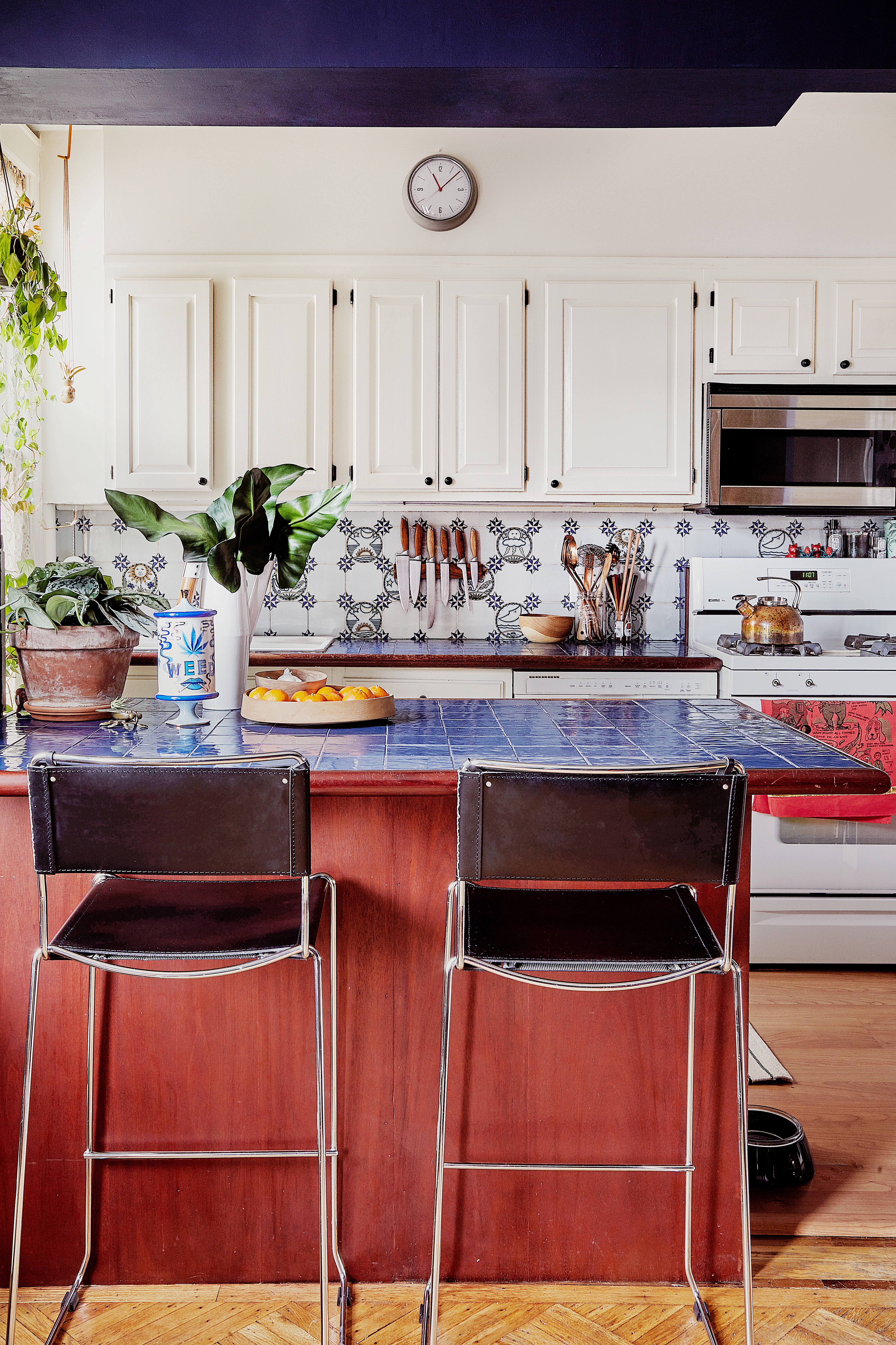 Kitchen with blue countertops and white cabinets