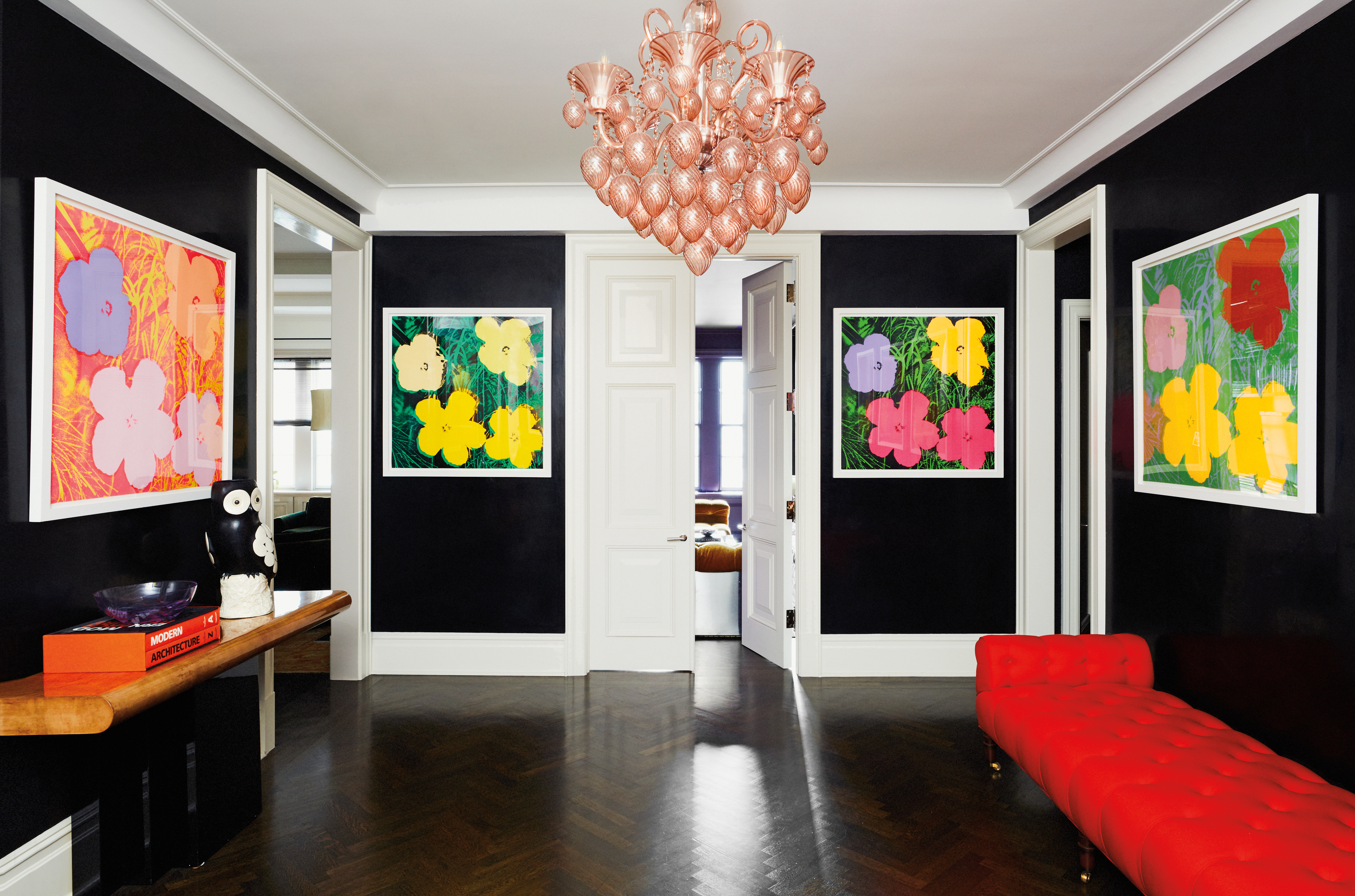 black entryway with Andy Warhol prints