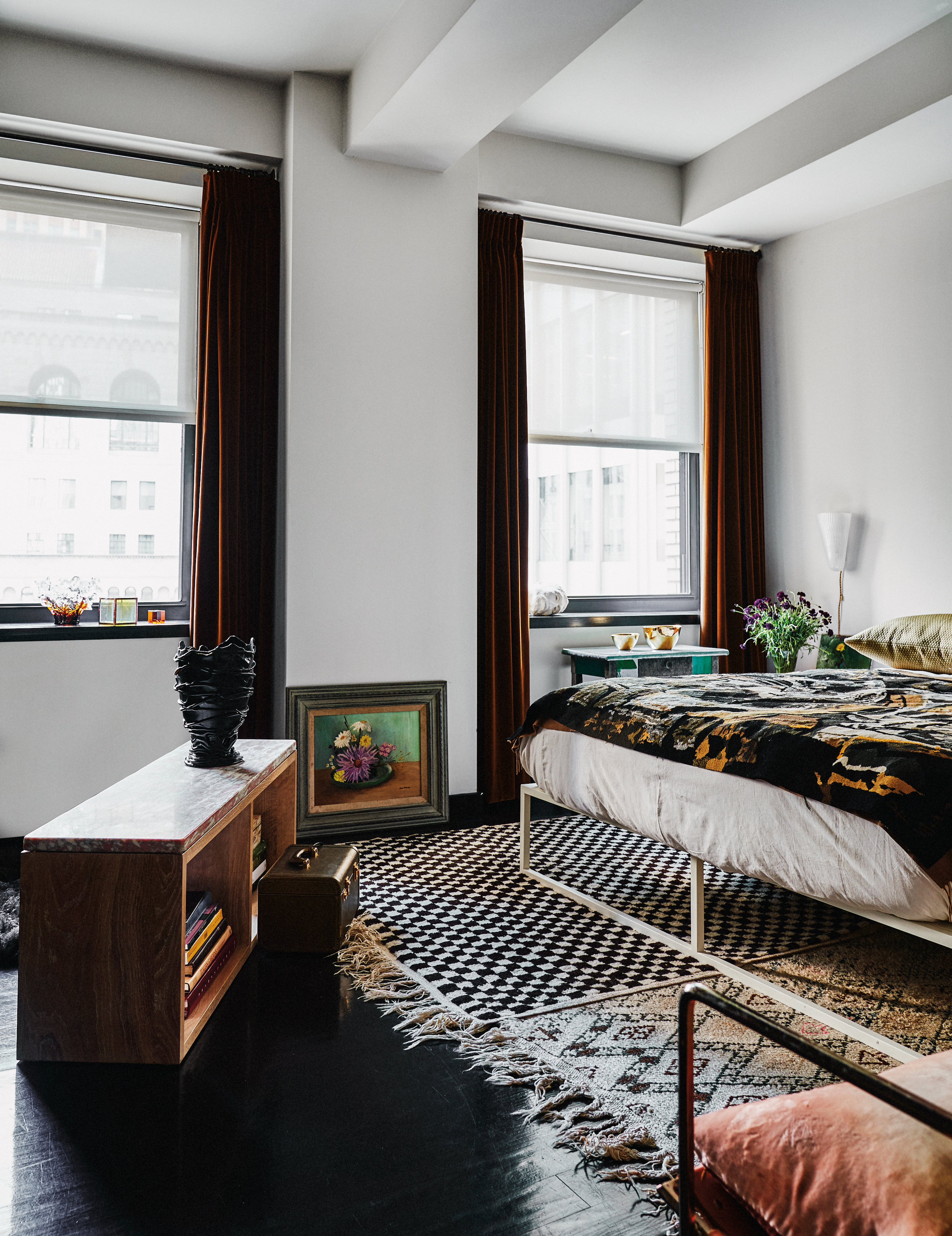 eclectic primary bedroom with large windows