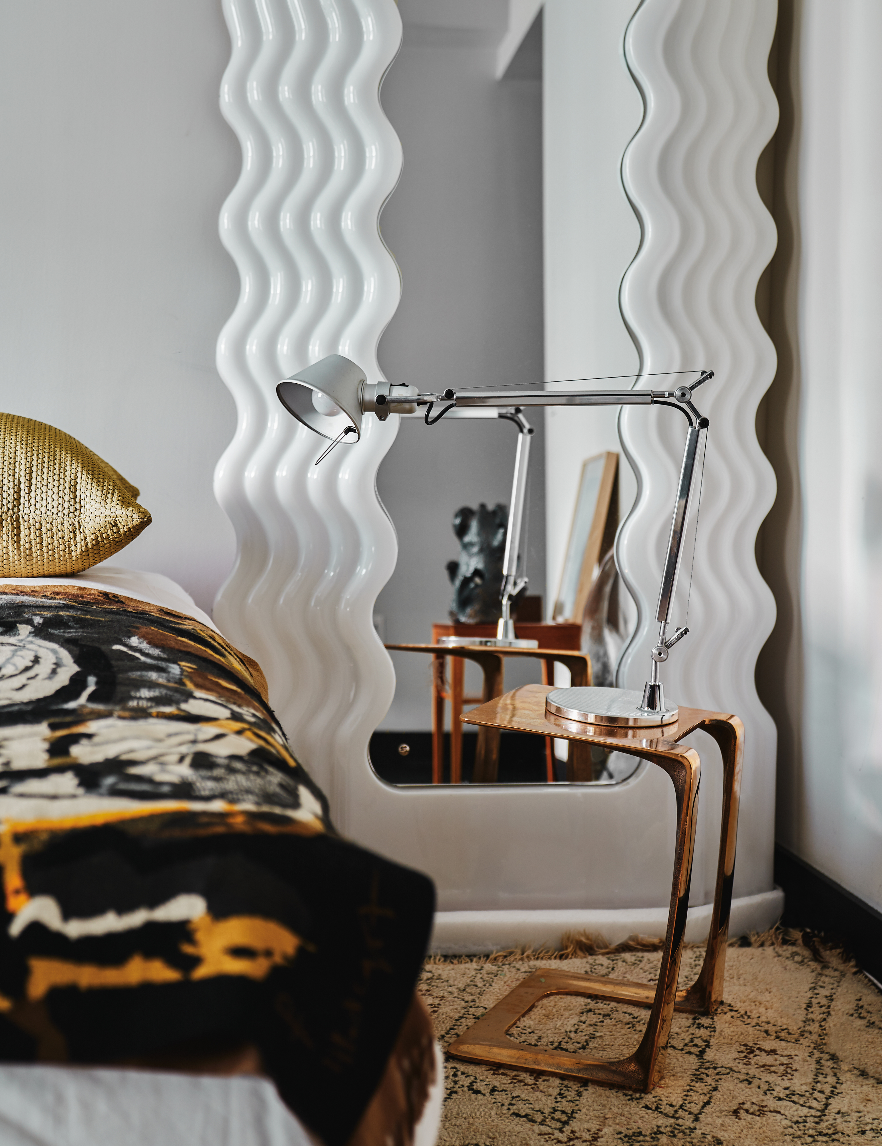 Etorre Sottsass wavy mirror next to bed