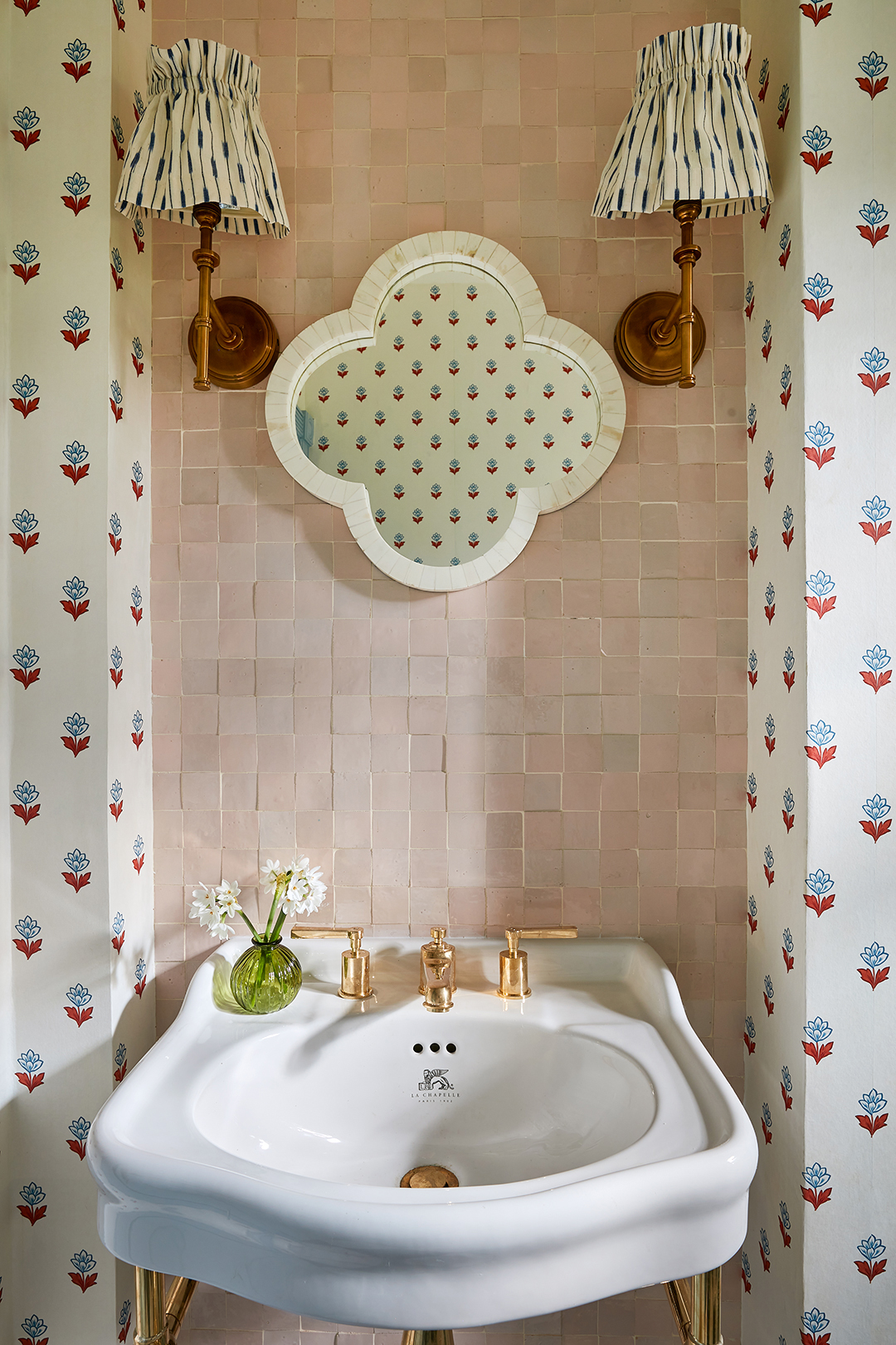 red flower wallpaper next to sink