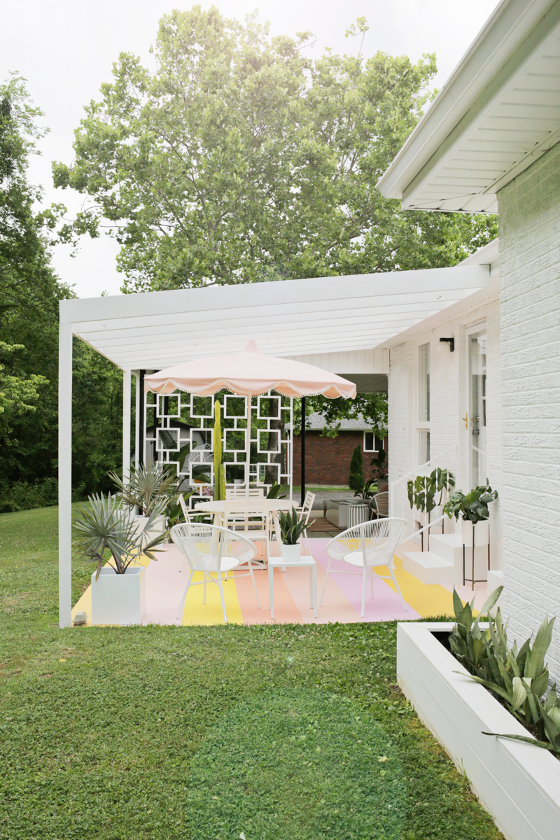 covered patio with bright striped painted flooring