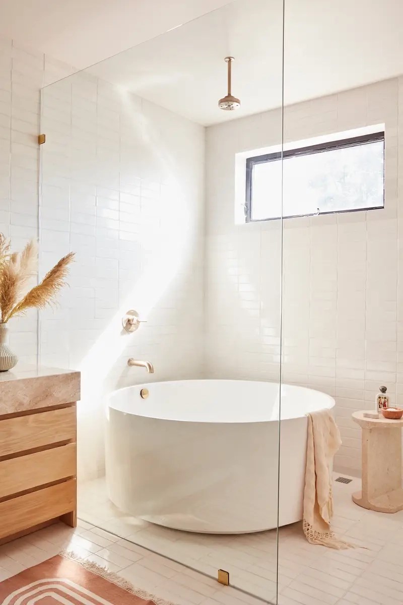 Bathroom with freestanding tub in the shower.