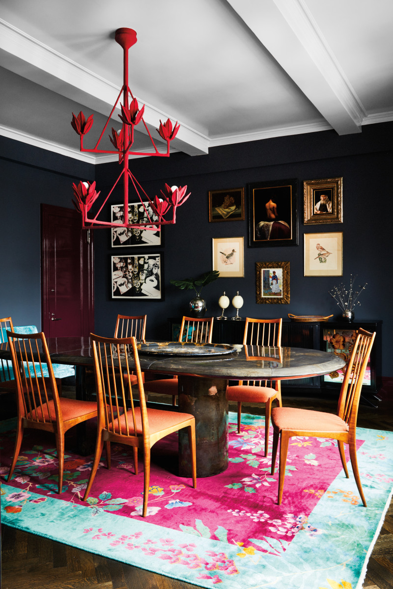 eclectic dining room with floral rug