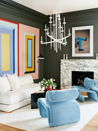 living room with three colorful square murals