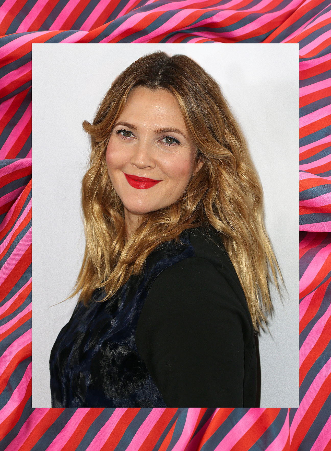 drew barrymore against a pink background