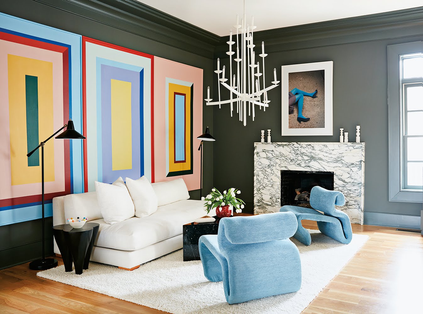 living room with three colorful square murals
