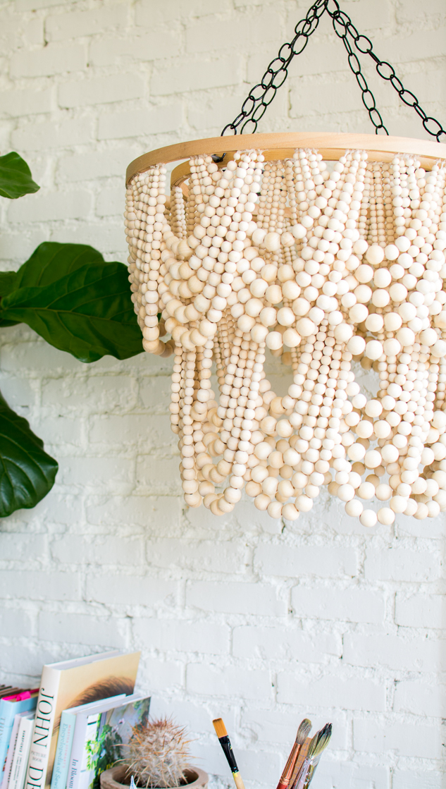 beaded chandelier next to a plant