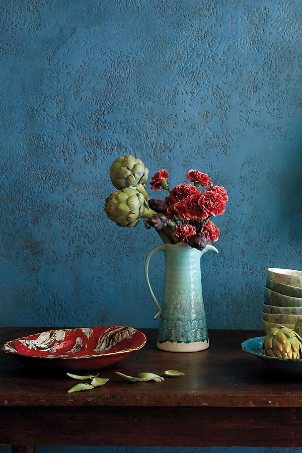 table vignette with peacock blue pitcher filled with flowers