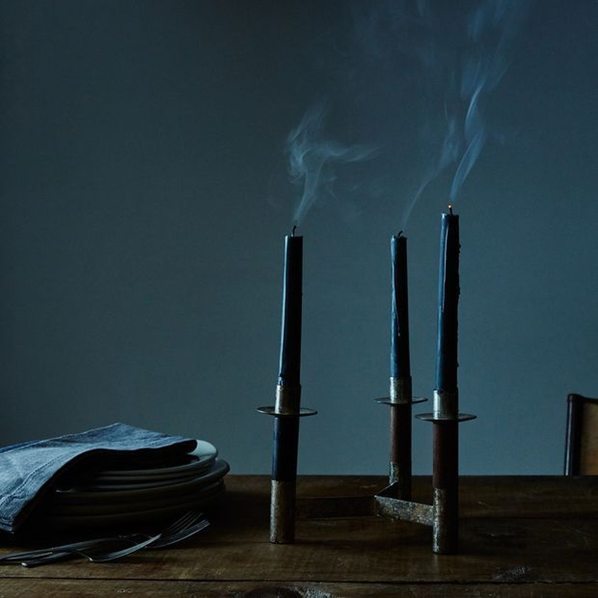 black taper candles on a table