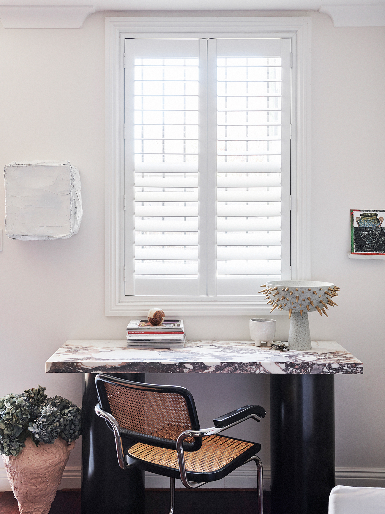 Modern desk overlooking a window.