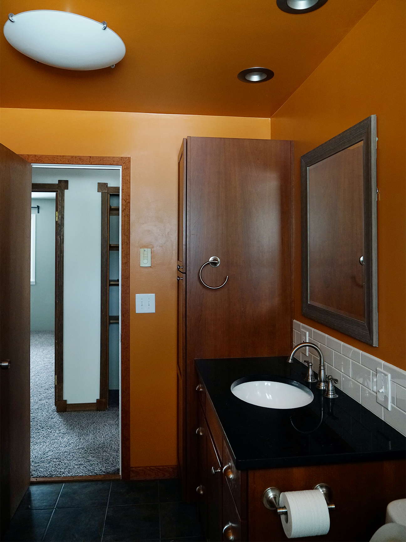 before shot of an orange small master bathroom