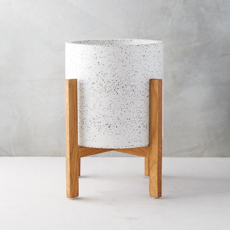  white terrazzo planter with a wood stand