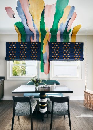 dining room with a blotch of paints going up to the ceiling