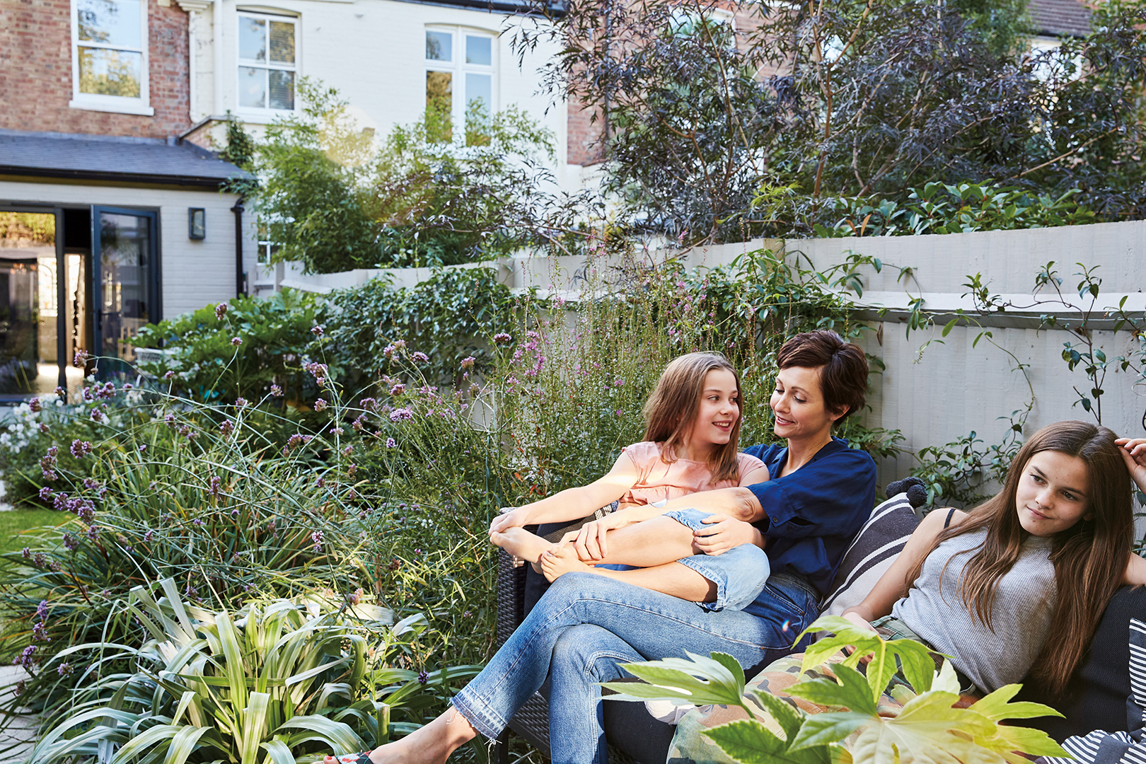 Jo Sampson and children in garden