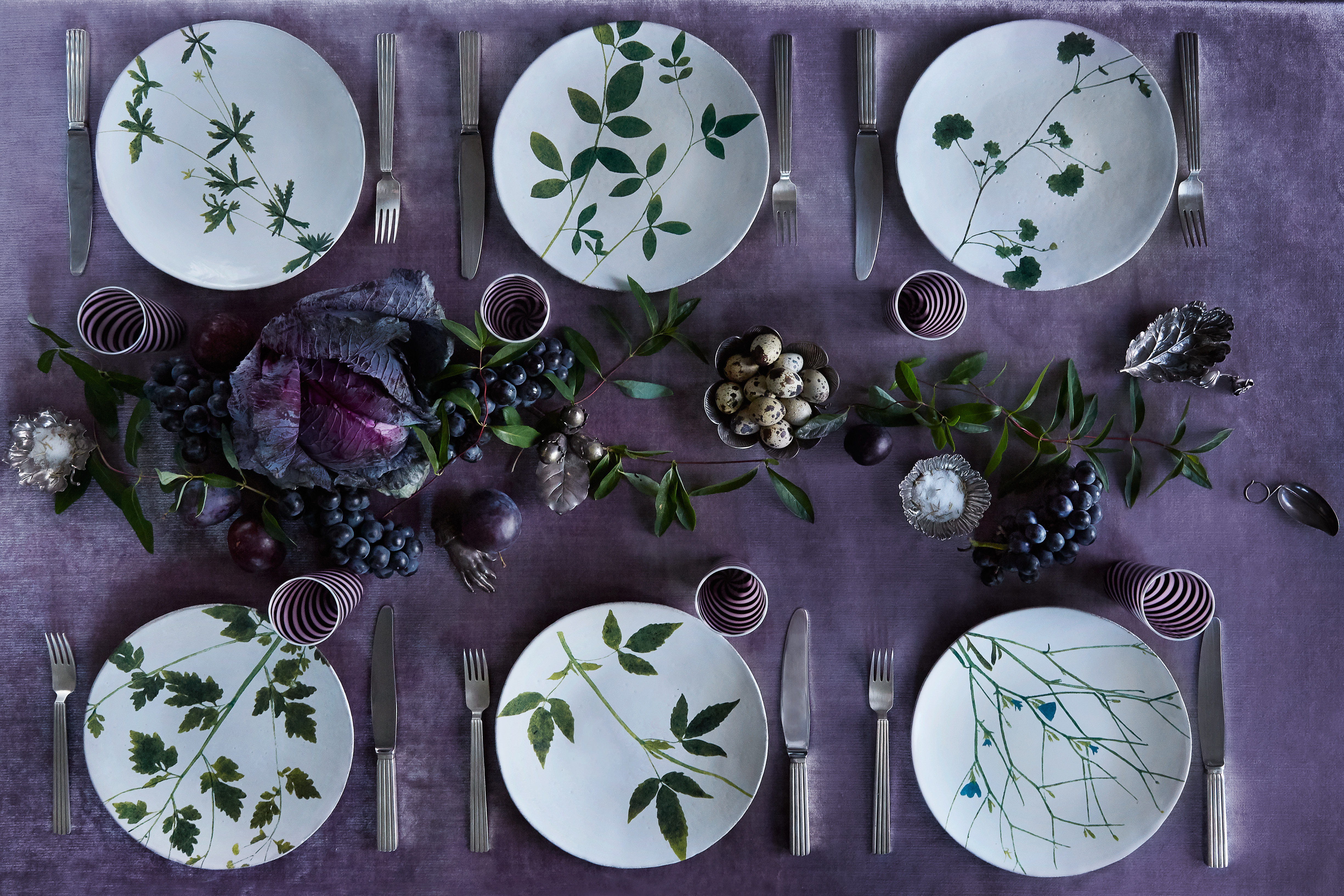 patterned floral plates on a dark purple table